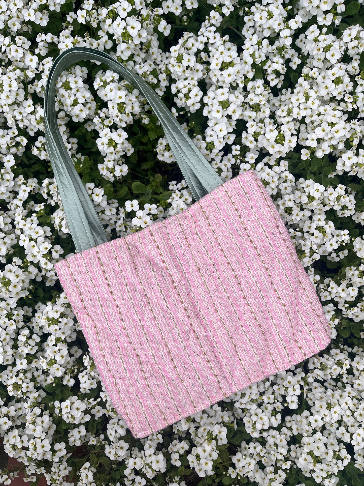 The Corbridge large handbag crafted from heritage tweed, featuring structured satin handles and polished metal hardware for a refined, timeless look.