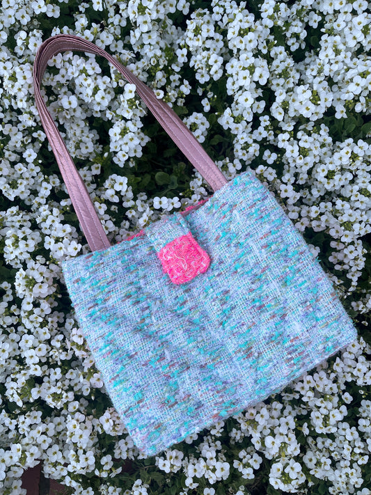 The Hexham large tote bag made from premium tweed, complete with structured satin handles and refined metal hardware