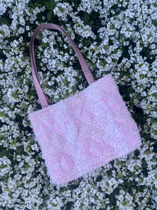 The Morpeth medium handbag in classic tweed, featuring structured satin handles and polished metal hardware.